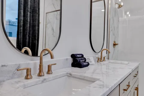 a living room with furniture and floor to ceiling windows