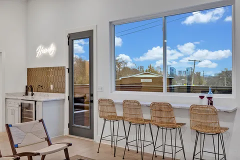 a group of people sitting in front of retail shop