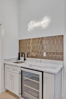 a front view of a retail shop and outdoor seating