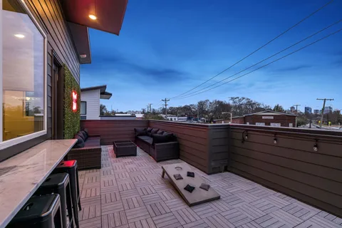 an aerial view of a house with yard swimming pool and outdoor seating