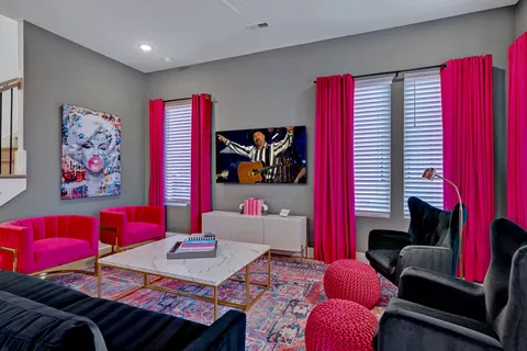a living room with furniture and a flat screen tv
