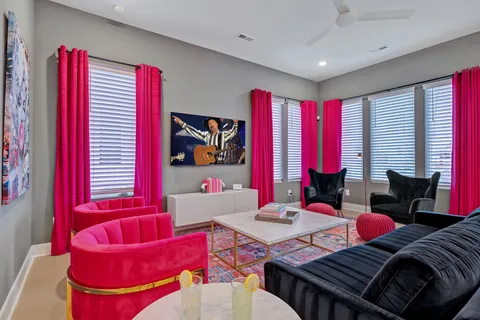 a view of a red chairs in a living room