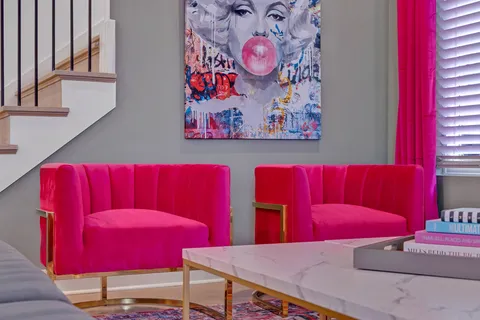 a living room with furniture and a rug