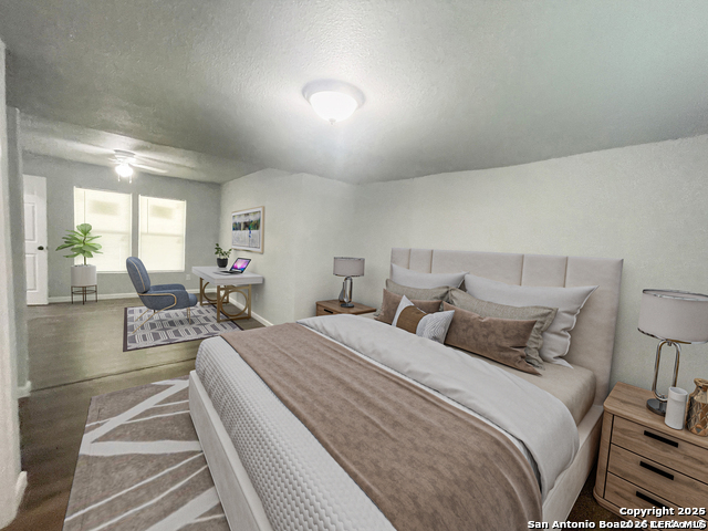 a bedroom with double bed and a large window