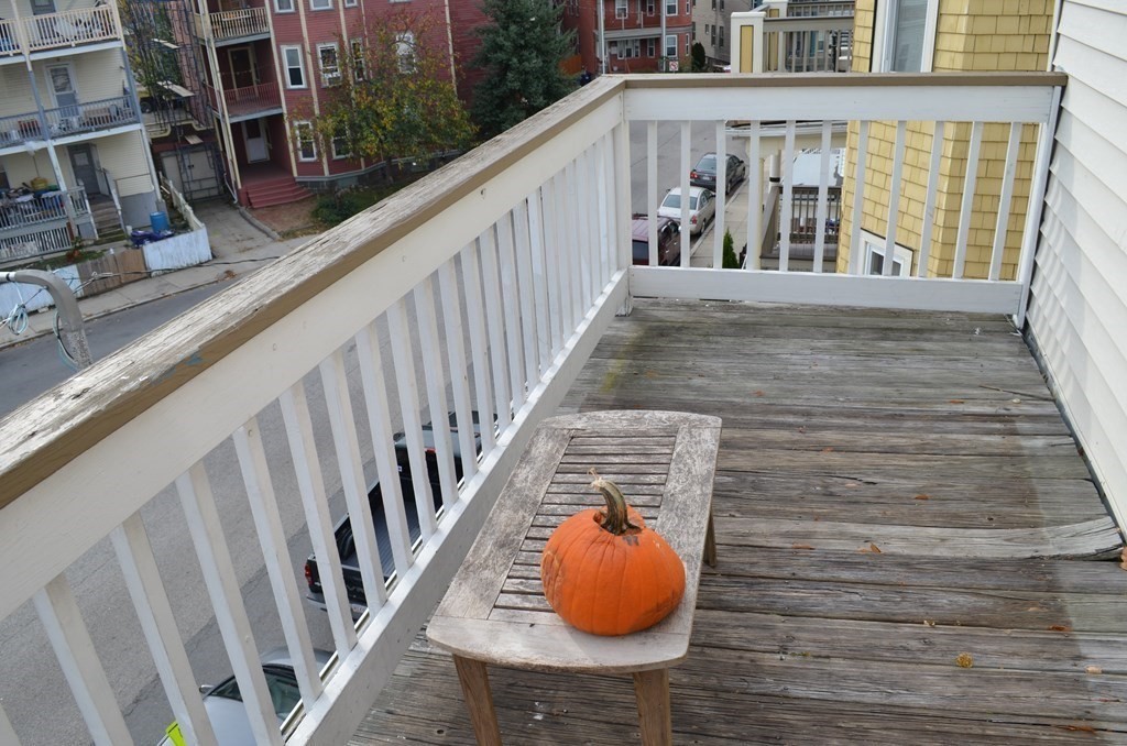 33 Edison Green, Unit 3 Boston, MA 02125 - Photo 11 of 11 a view of balcony with wooden floor