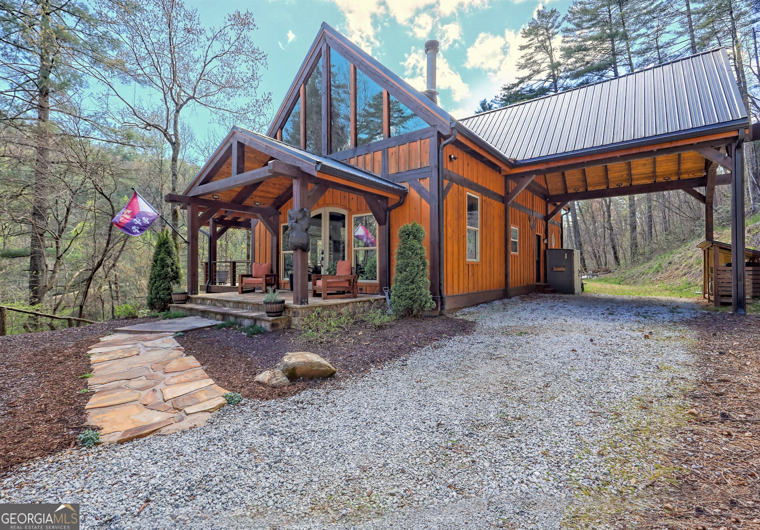 909 Rickman Airfield Road Clayton, GA 30525 - Photo 1 of 1 a backyard of a house with barbeque oven table and chairs