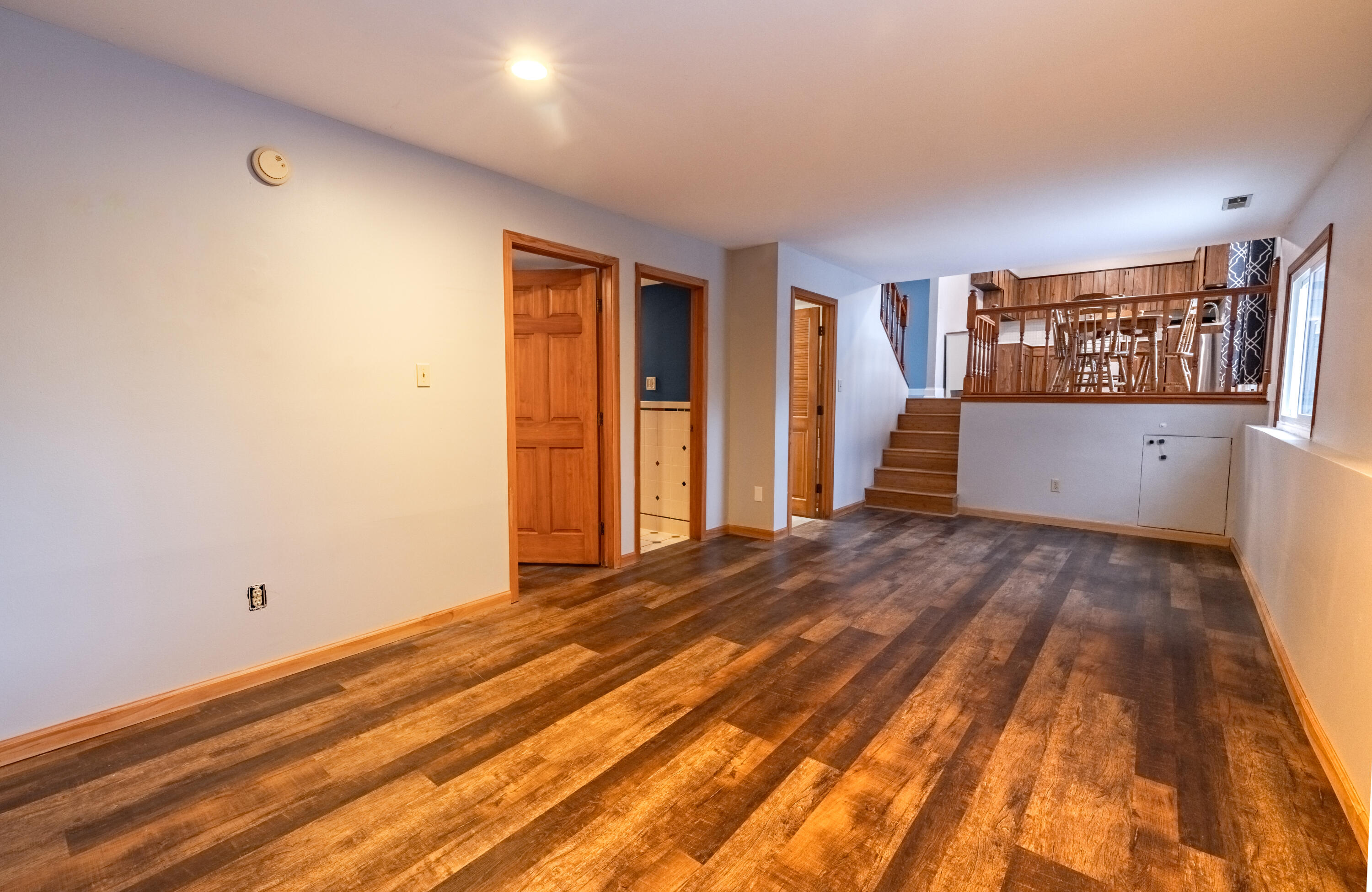 3229 Rustic Lane Crown Point, IN 46307 - Photo 12 of 18 a view of an empty room with window and wooden floor
