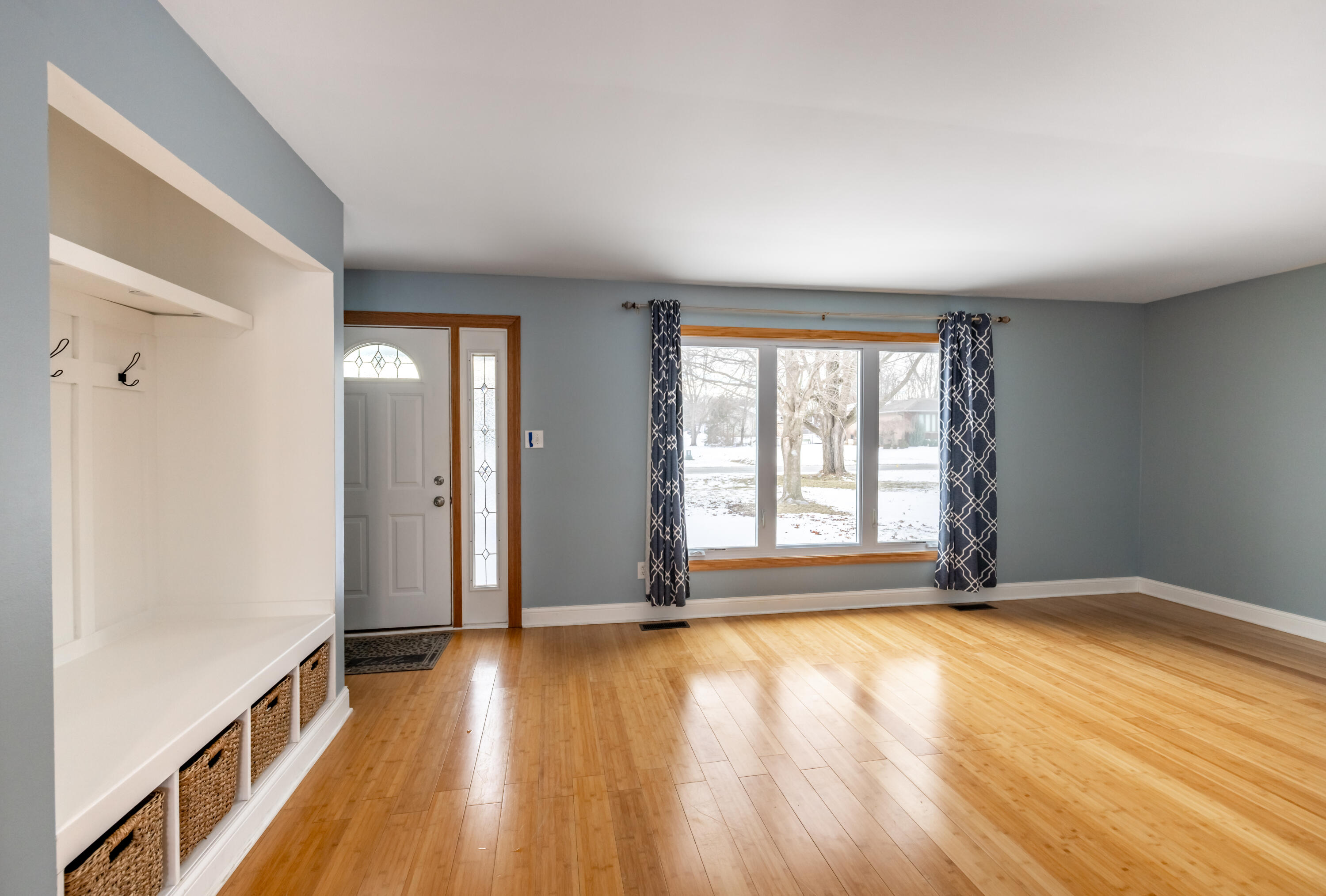 3229 Rustic Lane Crown Point, IN 46307 - Photo 3 of 18 an empty room with wooden floor and windows