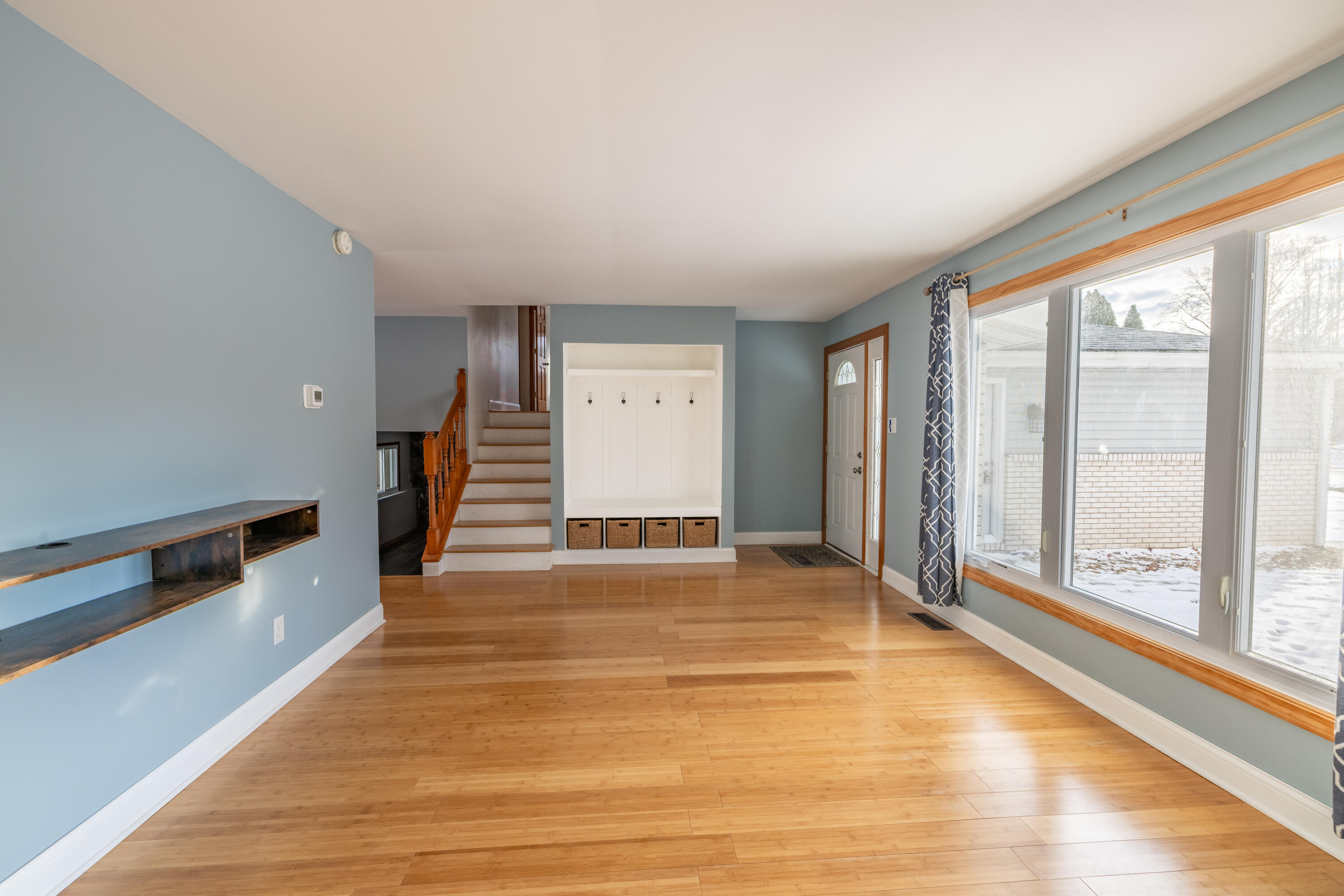 3229 Rustic Lane Crown Point, IN 46307 - Photo 4 of 18 a view of an empty room with wooden floor and a window