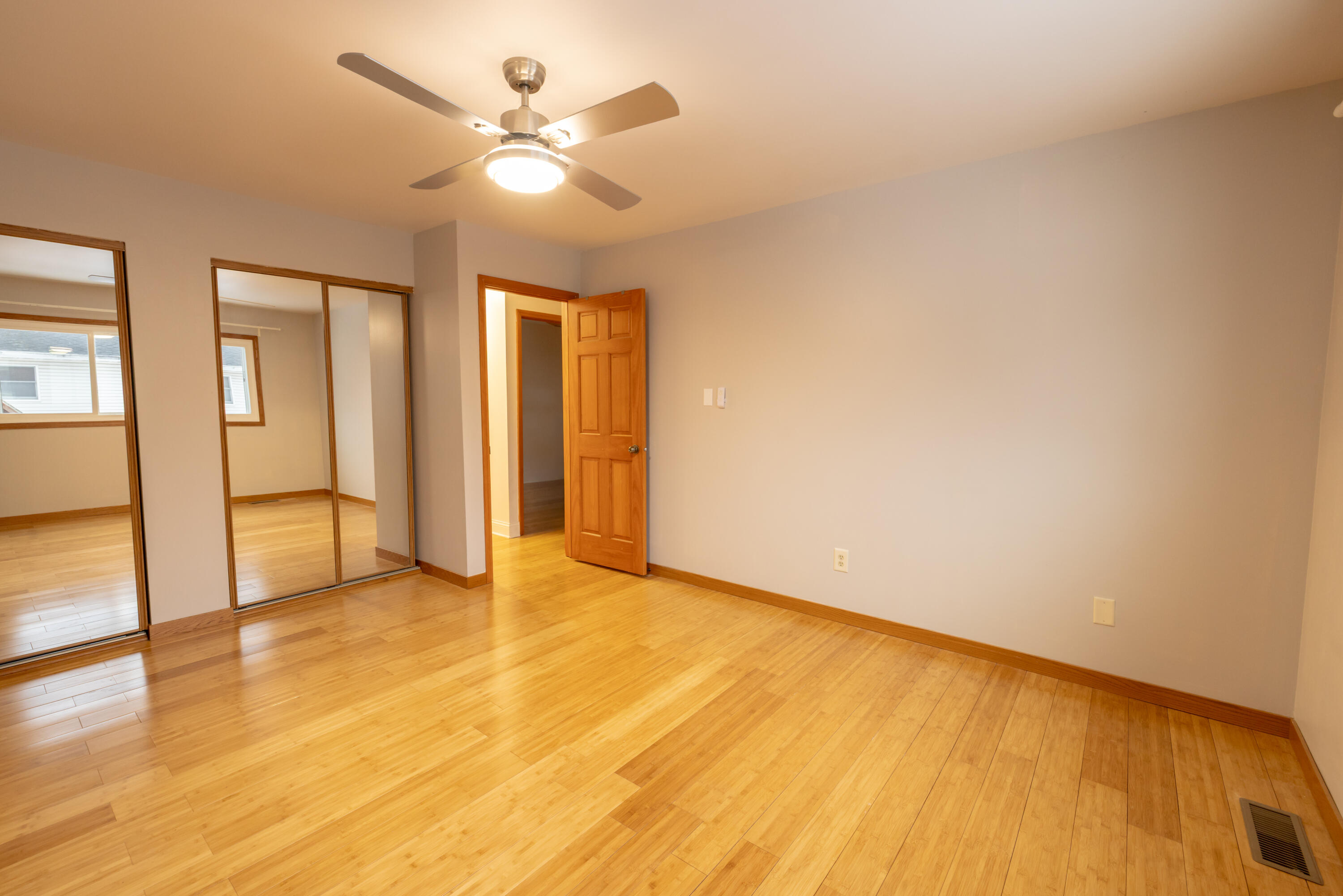 3229 Rustic Lane Crown Point, IN 46307 - Photo 5 of 18 an empty room with wooden floor and ceiling fan