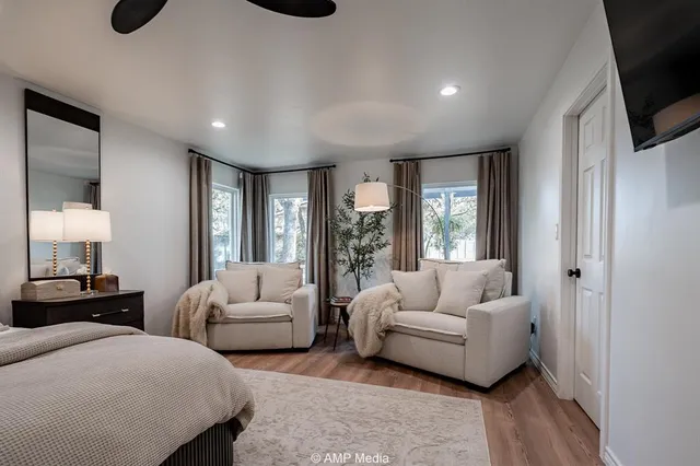 a spacious bathroom with a double vanity sink and a mirror