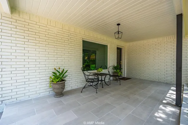a living room with furniture and a painting