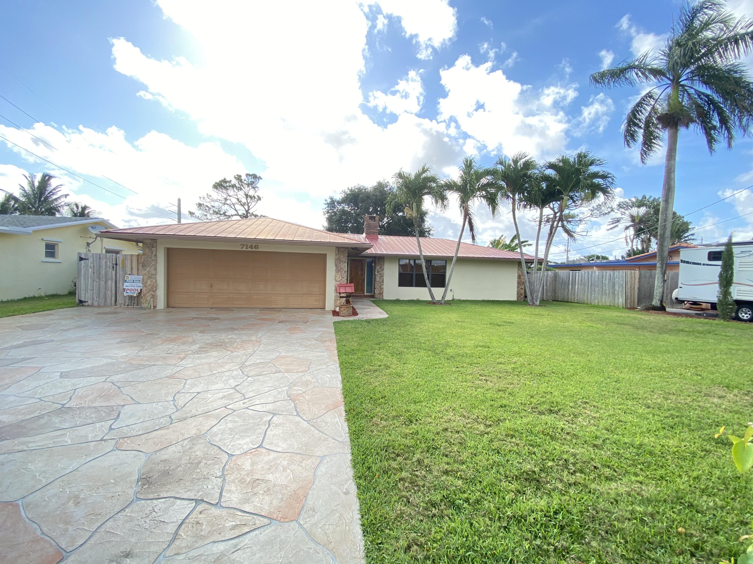 7146 Thompson Road Boynton Beach, FL 33426 - Photo 1 of 23 Exterior Front