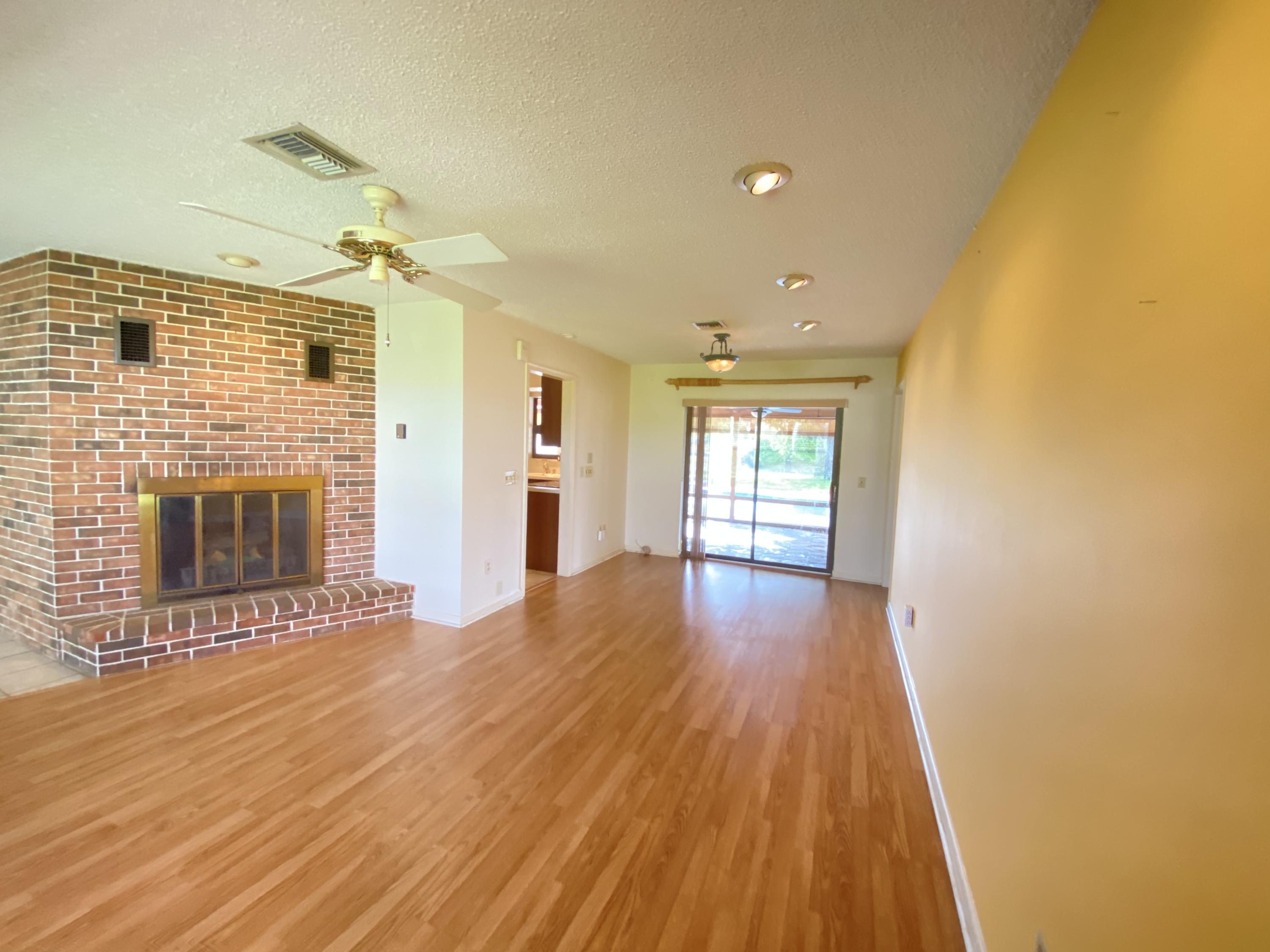 7146 Thompson Road Boynton Beach, FL 33426 - Photo 15 of 23 Living room with fireplace