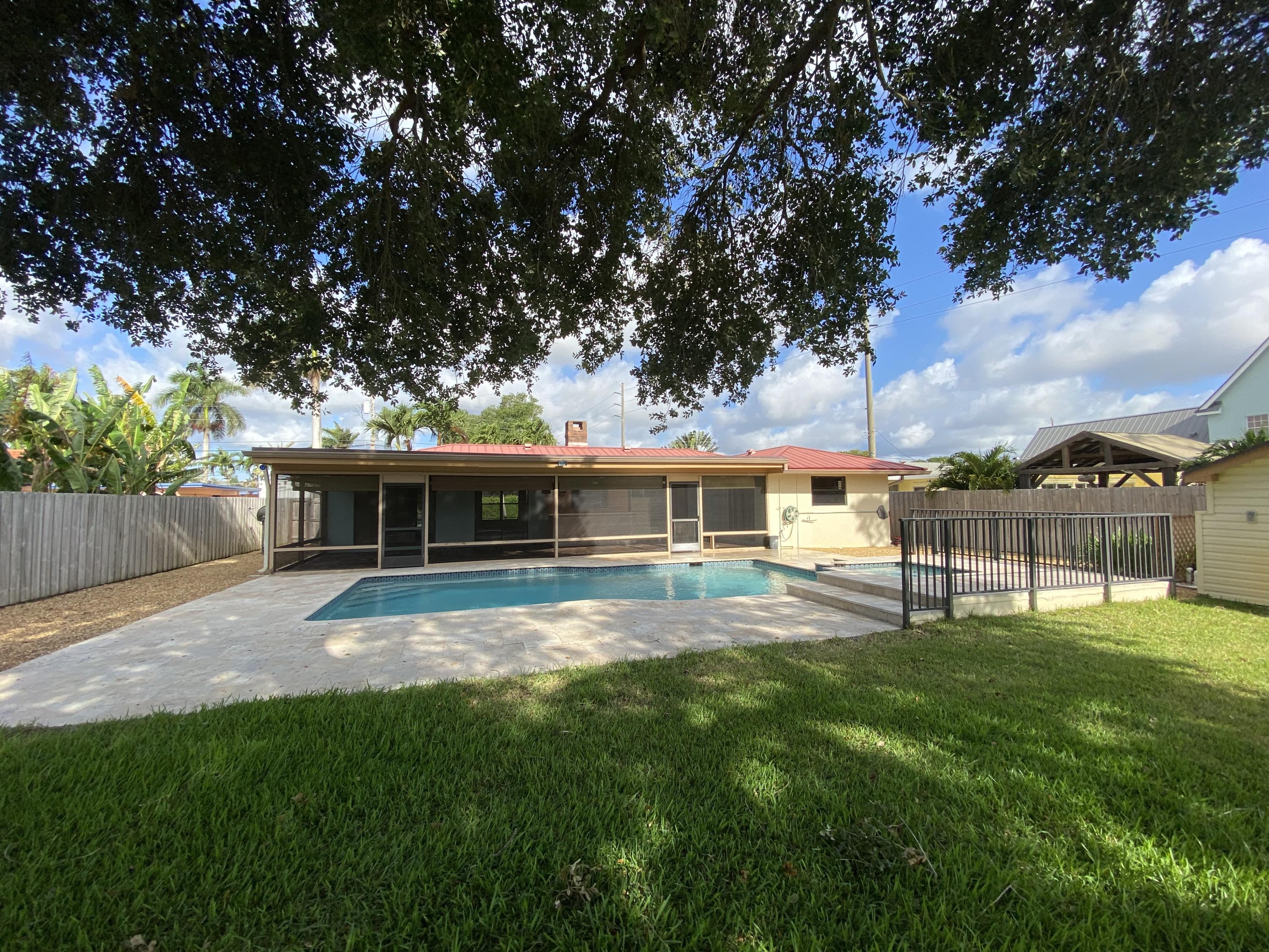 7146 Thompson Road Boynton Beach, FL 33426 - Photo 17 of 23 Spacious backyard with pool