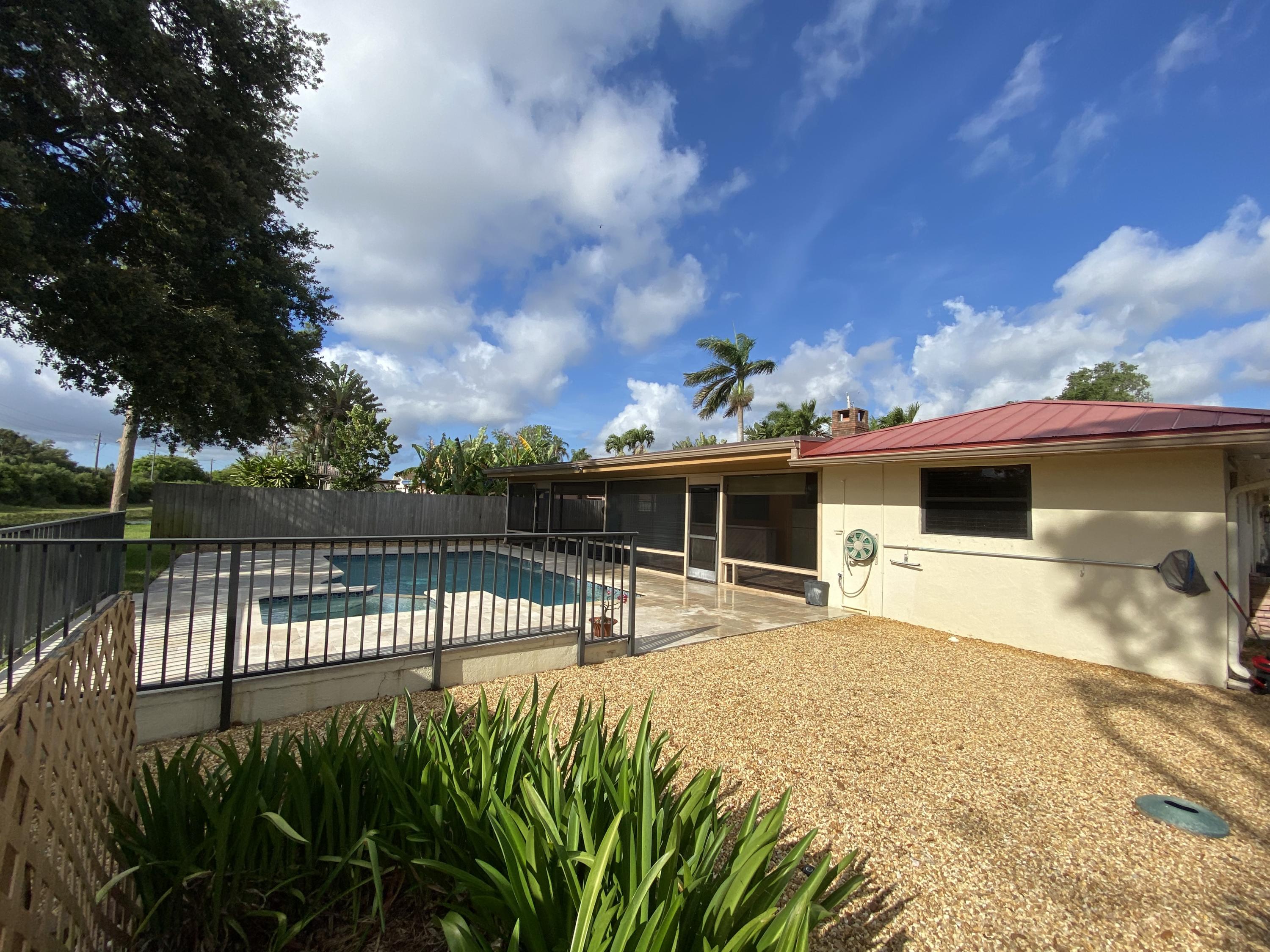 7146 Thompson Road Boynton Beach, FL 33426 - Photo 21 of 23 Spacious backyard with pool