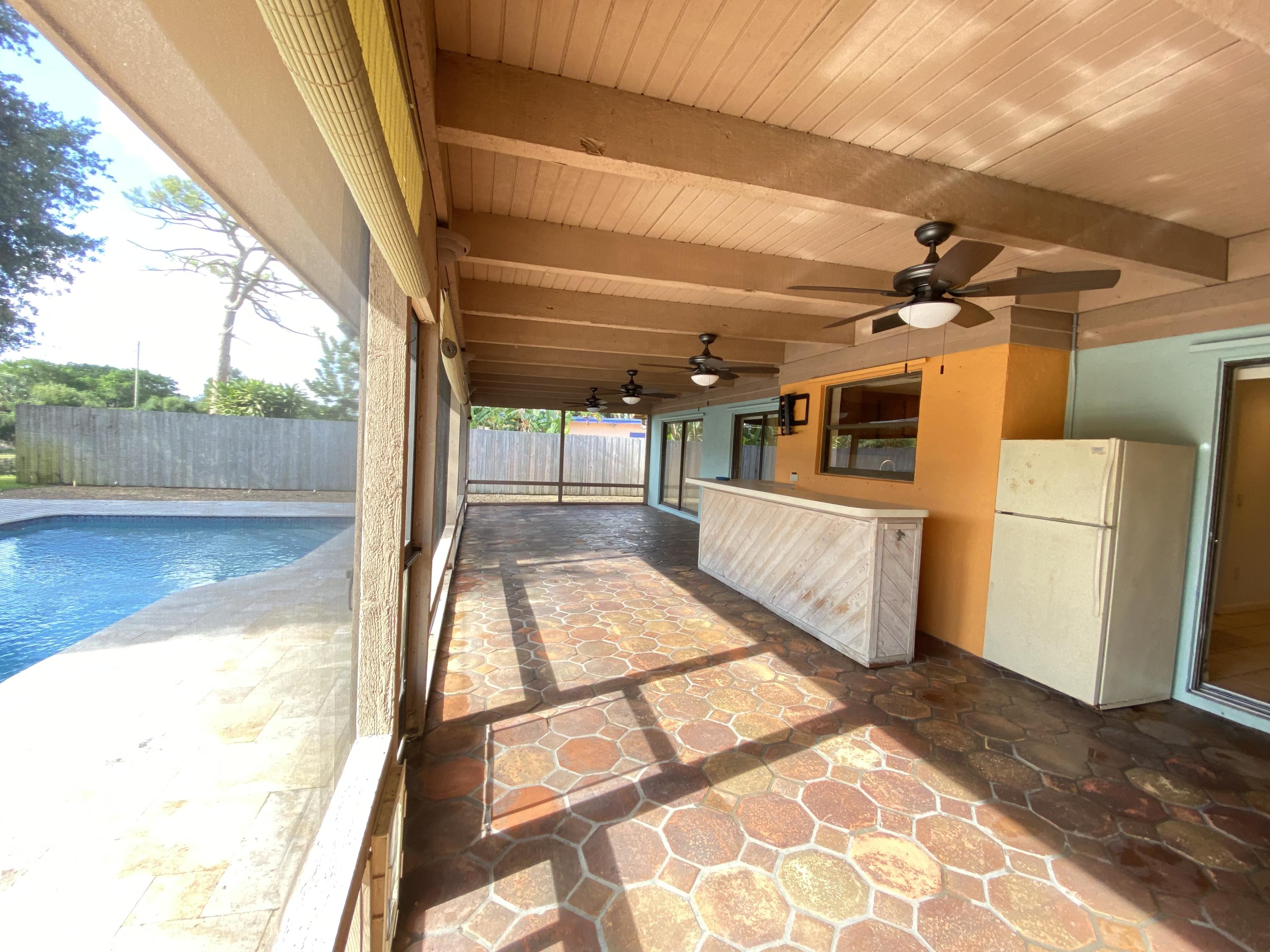 7146 Thompson Road Boynton Beach, FL 33426 - Photo 4 of 23 Covered porch