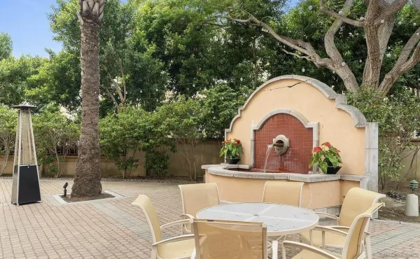 a view of house with outdoor seating