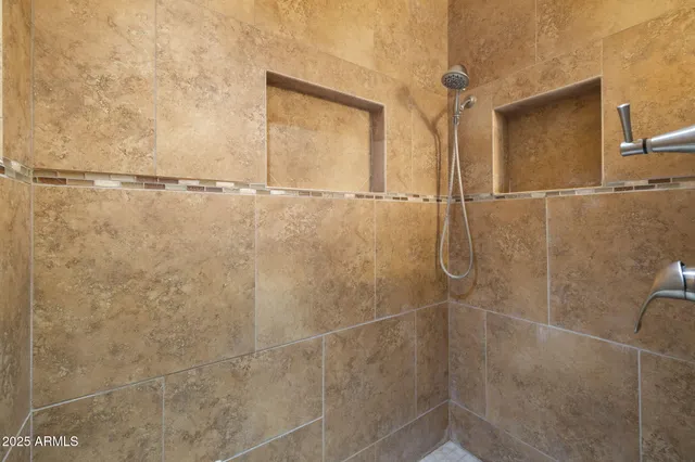 a bathroom with a granite countertop toilet and a sink