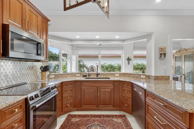 a view of a dining room with furniture wooden floor and chandelier