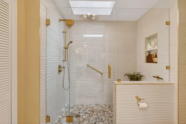 a view of a storage and utility room with washer and dryer