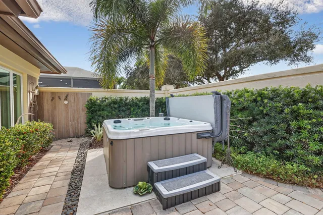 an aerial view of a house with a swimming pool yard and outdoor seating
