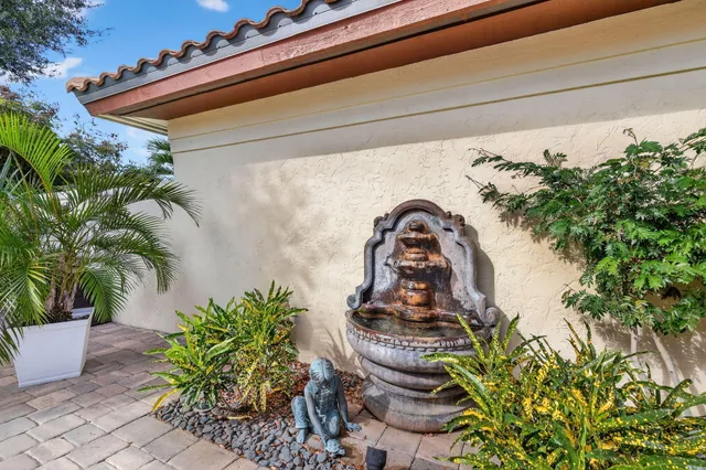 a view of a lake with a table and chairs