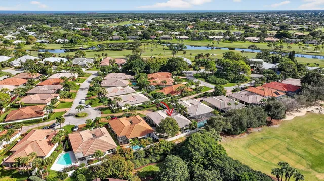 a dining room with furniture window and wooden floor