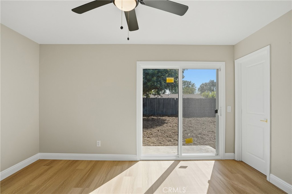 2924 Louisiana Place Riverside, CA 92506 - Photo 36 of 42 an empty room with wooden floor and windows