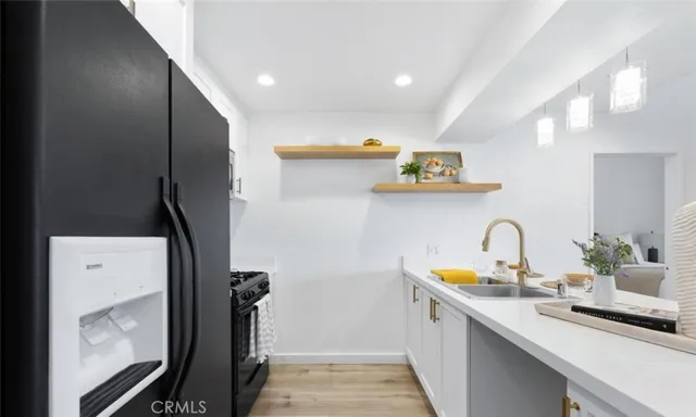 a hallway with sink and mirror
