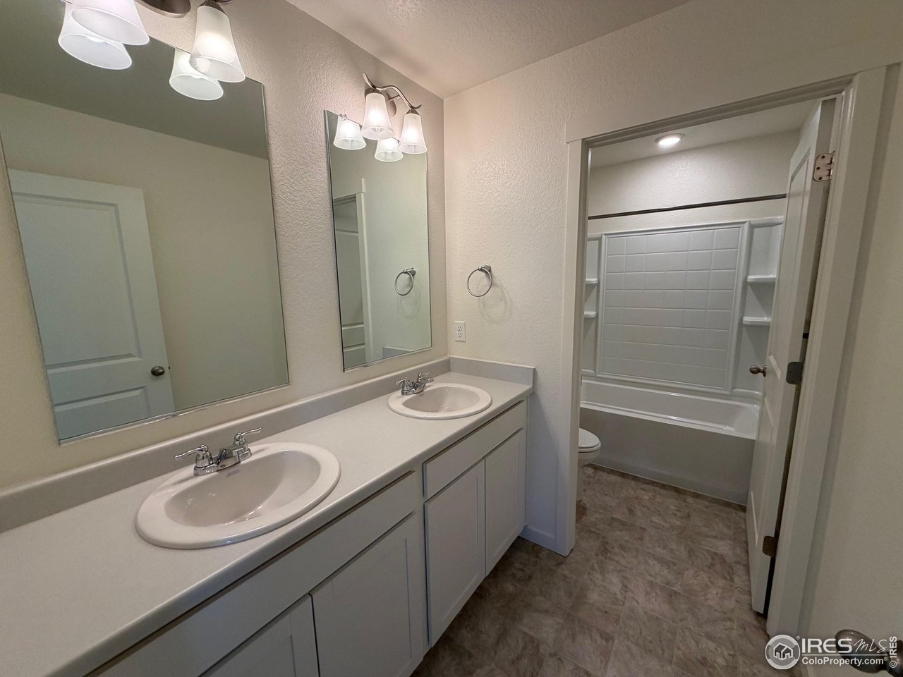 107 65th Avenue Greeley, CO 80634 - Photo 19 of 38 Guest bath on upper level with 2 sinks