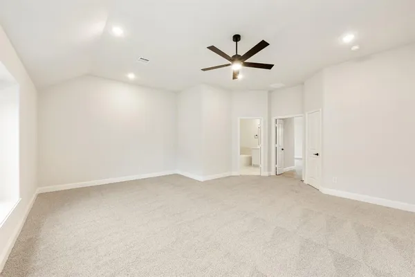 a bathroom with a tub a sink and mirror