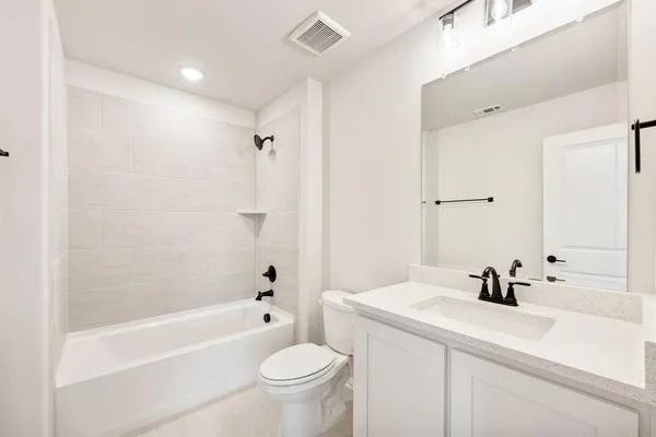 a view of house with backyard