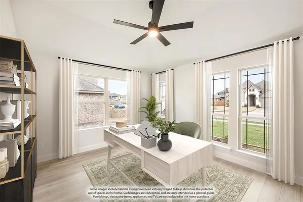 a view of a livingroom with furniture and a window