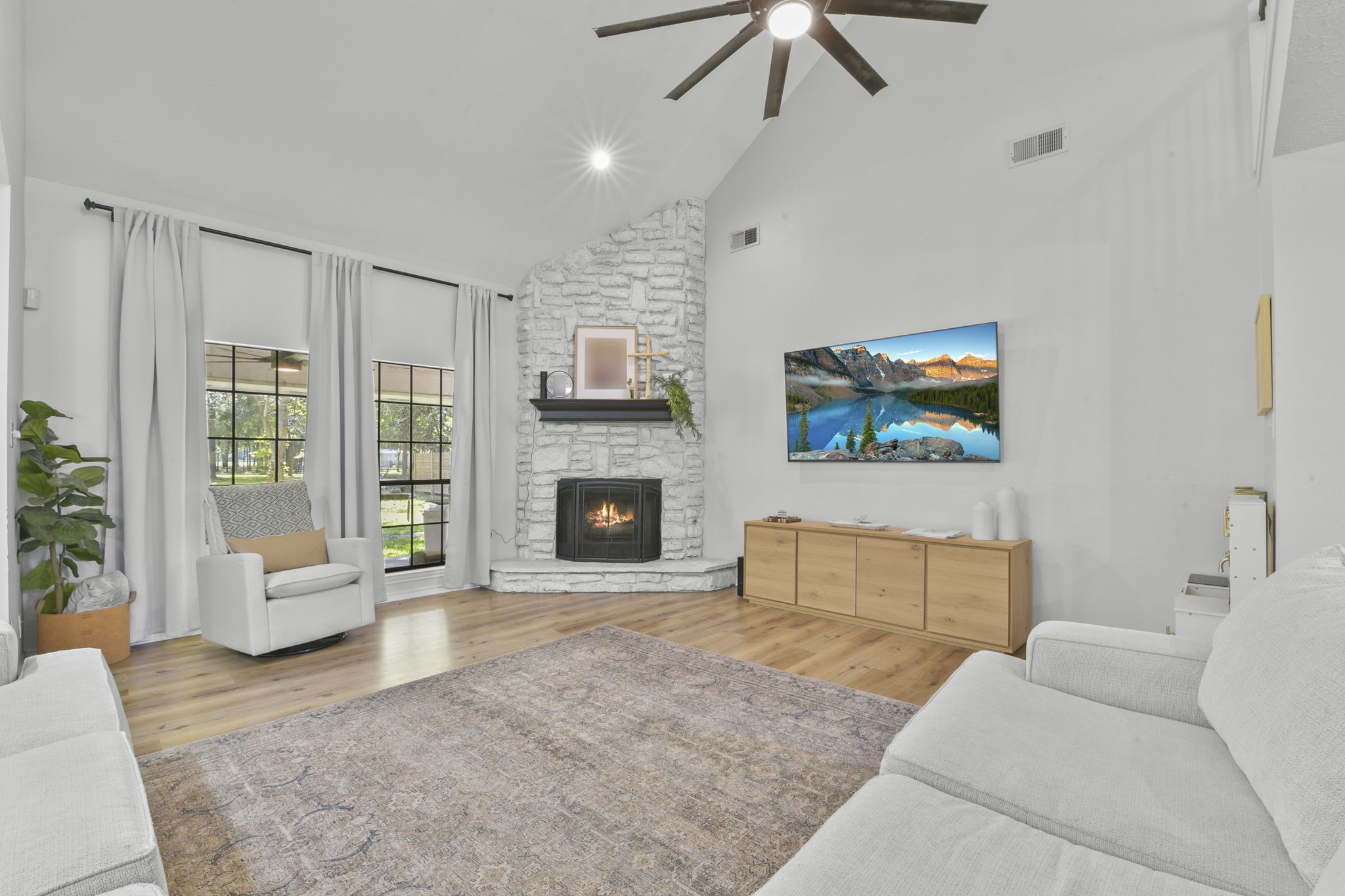 223 Oetken West Road Anahuac, TX 77514 - Photo 11 of 50 a living room with furniture and a fireplace