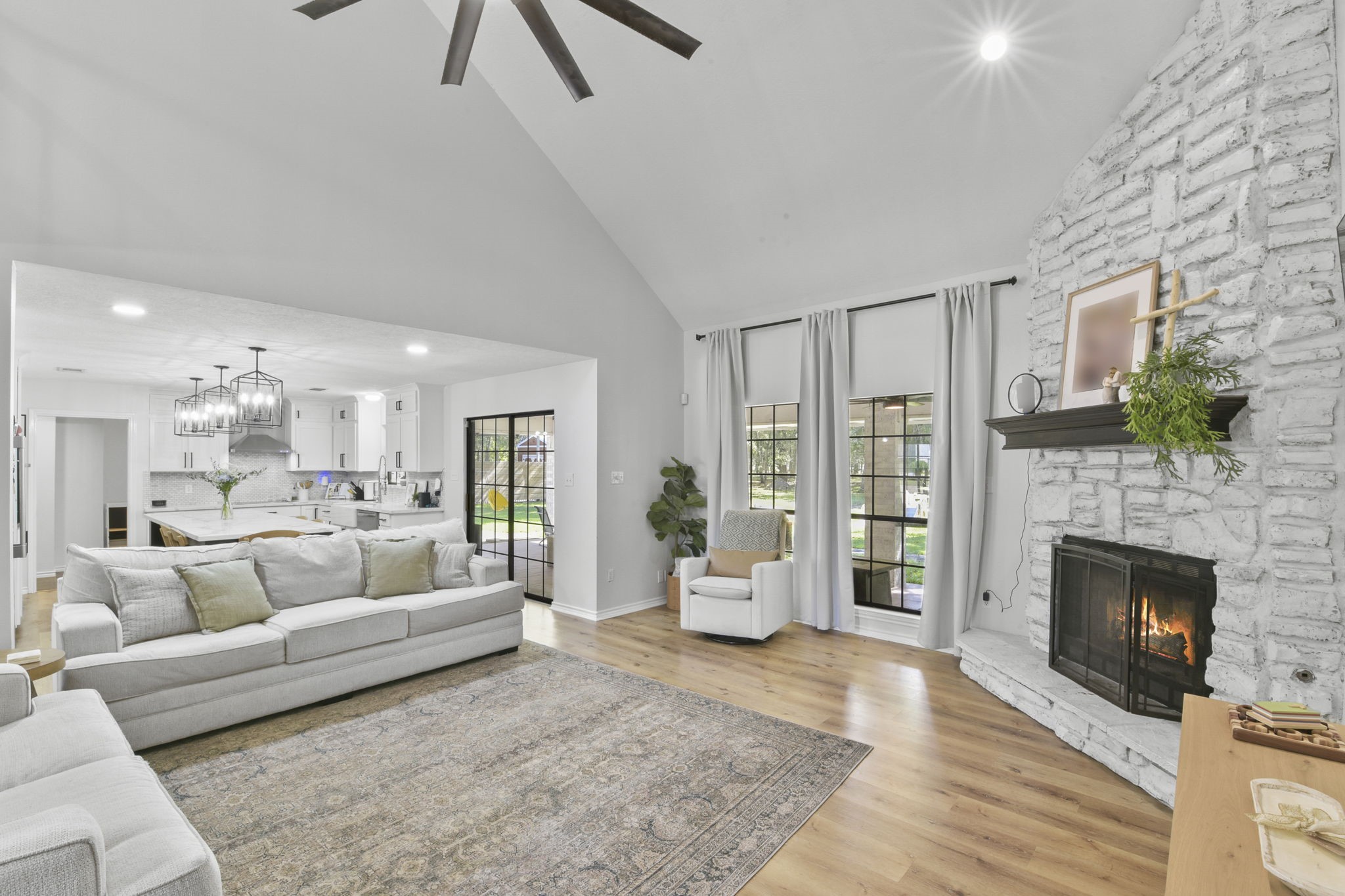 223 Oetken West Road Anahuac, TX 77514 - Photo 13 of 50 a living room with furniture and a fireplace