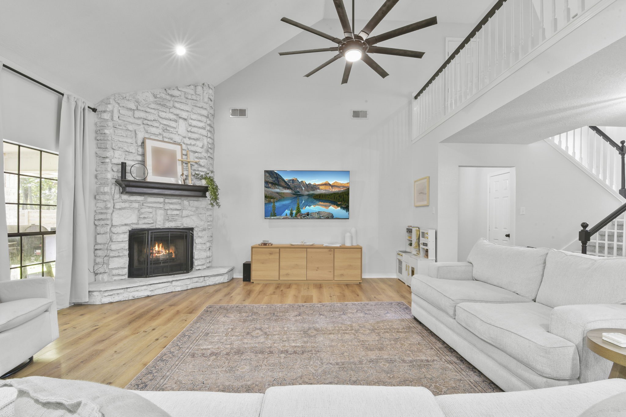 223 Oetken West Road Anahuac, TX 77514 - Photo 14 of 50 a living room with furniture and a fireplace