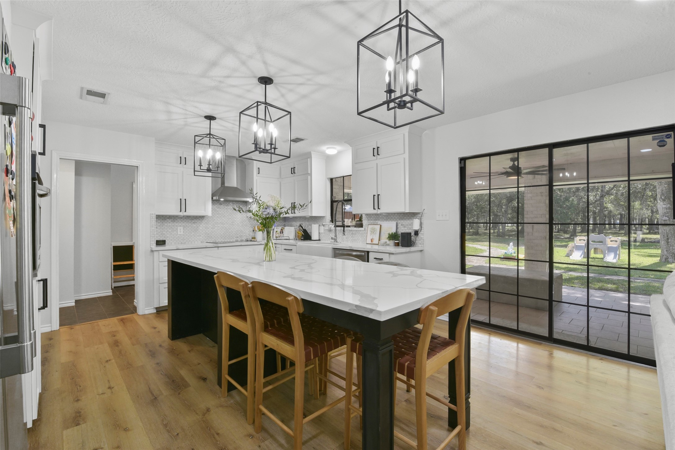 223 Oetken West Road Anahuac, TX 77514 - Photo 17 of 50 a very nice looking dining room with wooden floor and chandelier