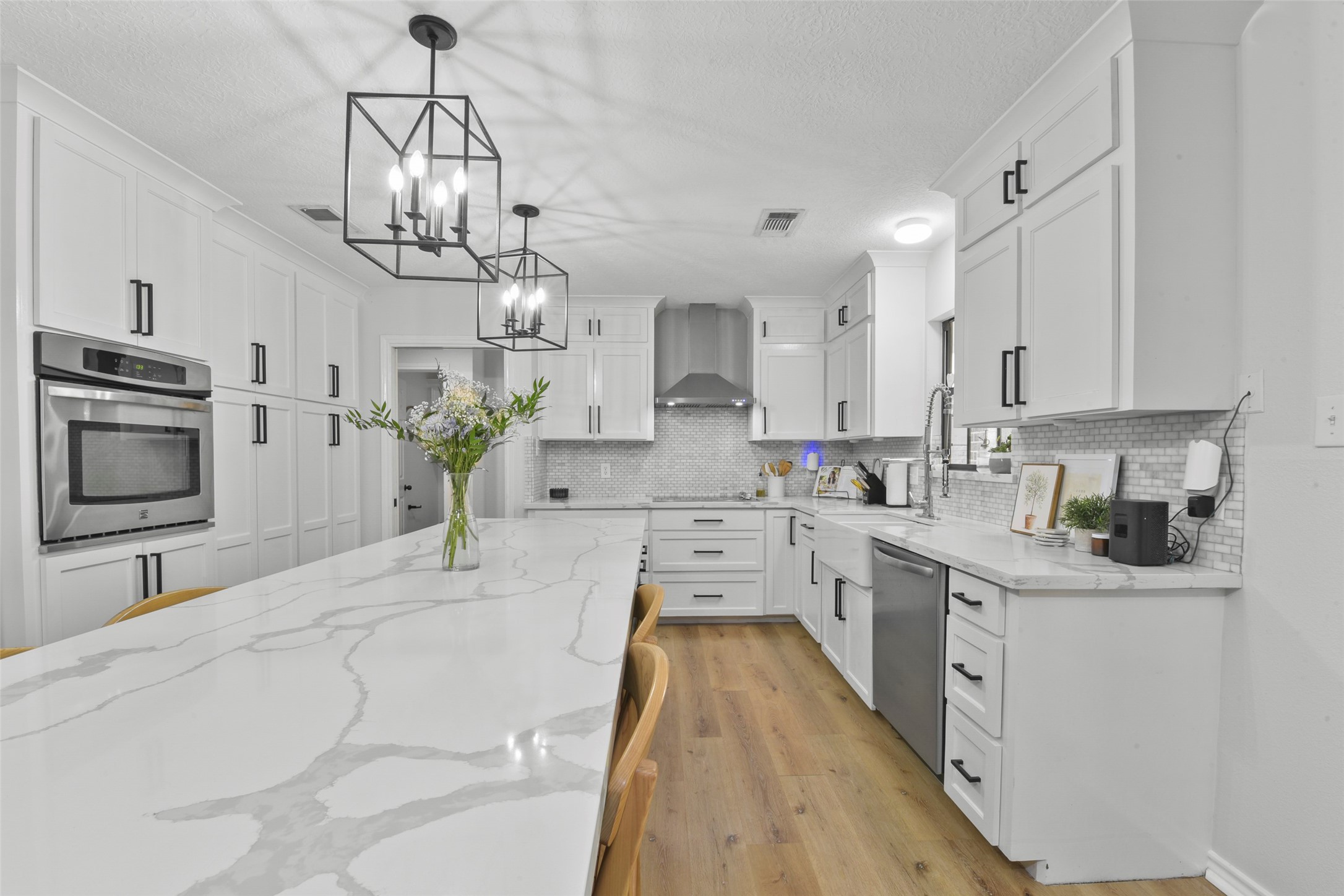 223 Oetken West Road Anahuac, TX 77514 - Photo 18 of 50 a kitchen with cabinets a sink and stainless steel appliances