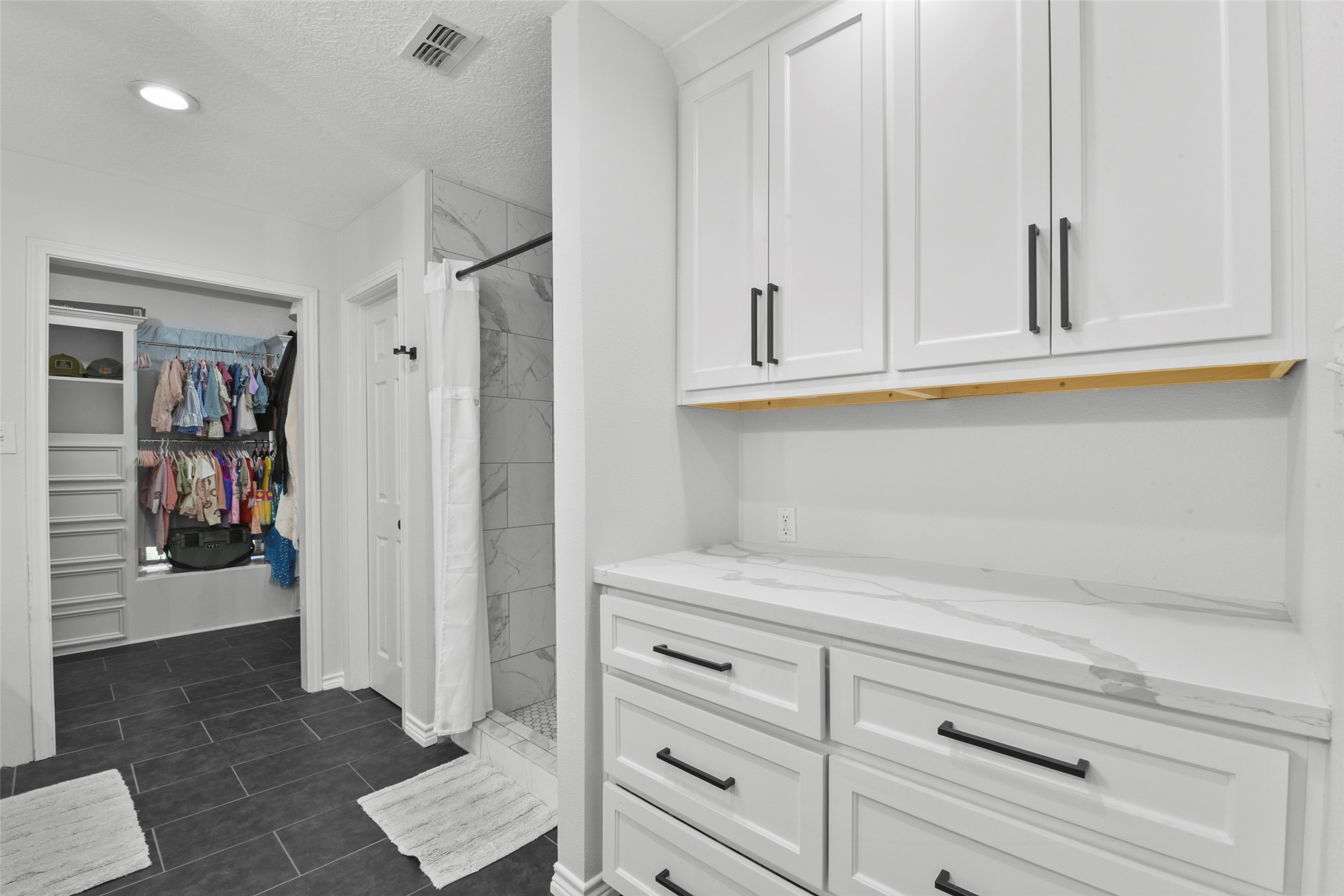 223 Oetken West Road Anahuac, TX 77514 - Photo 28 of 50 a view of walk in closet with clothes and shoes
