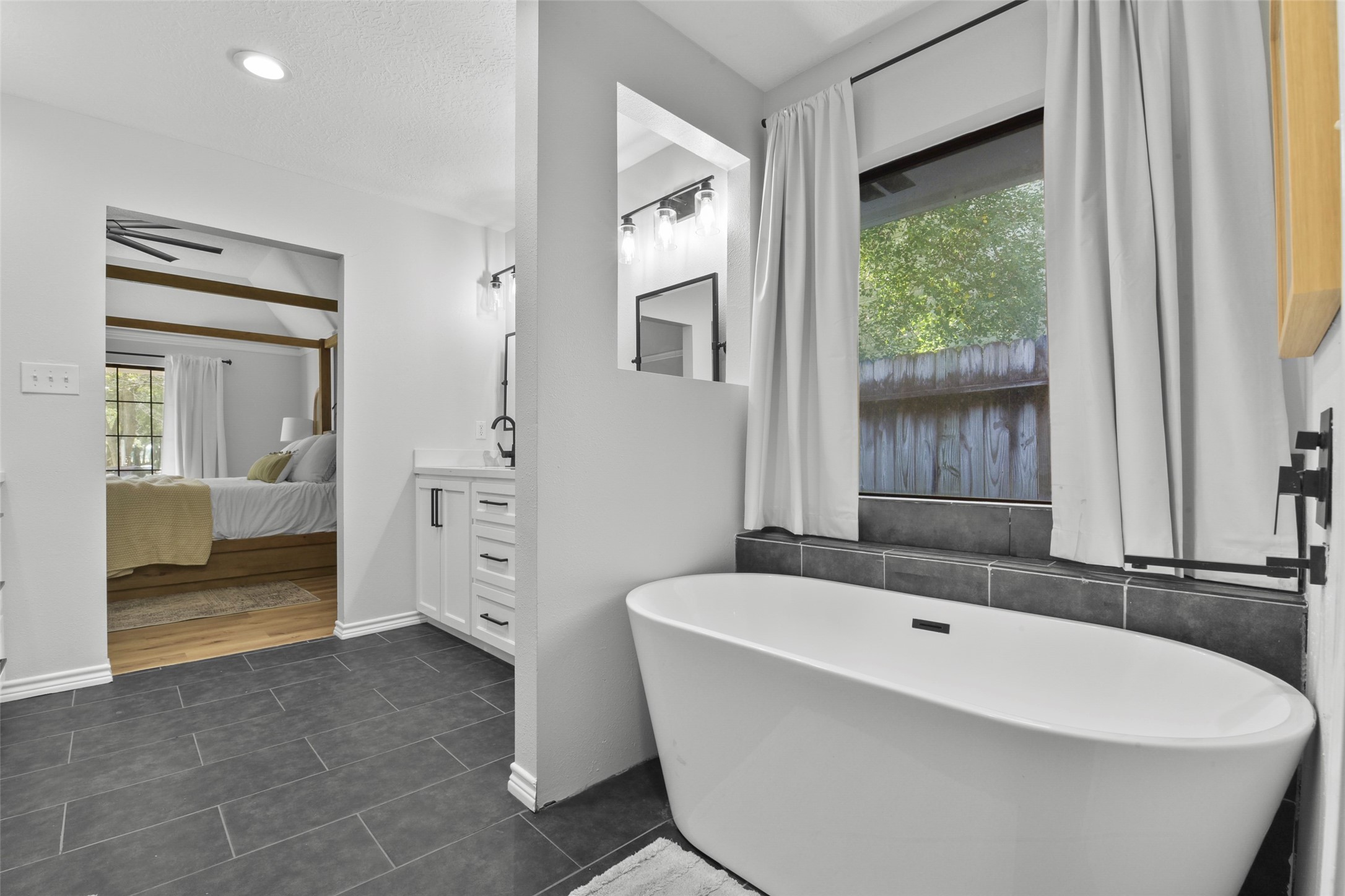 223 Oetken West Road Anahuac, TX 77514 - Photo 29 of 50 a bathroom with a bathtub and a sink