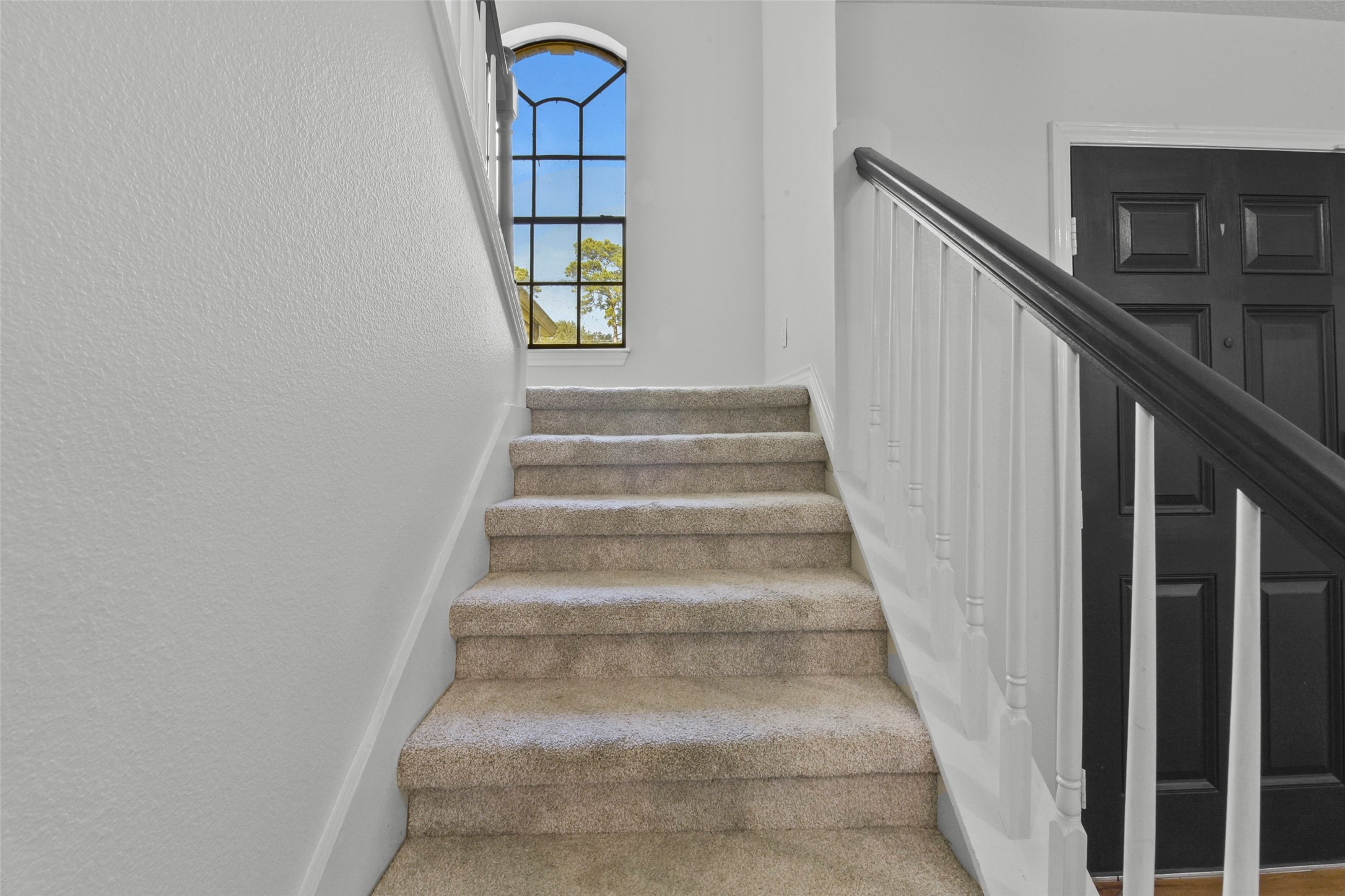 223 Oetken West Road Anahuac, TX 77514 - Photo 31 of 50 a view of staircase with white walls and windows