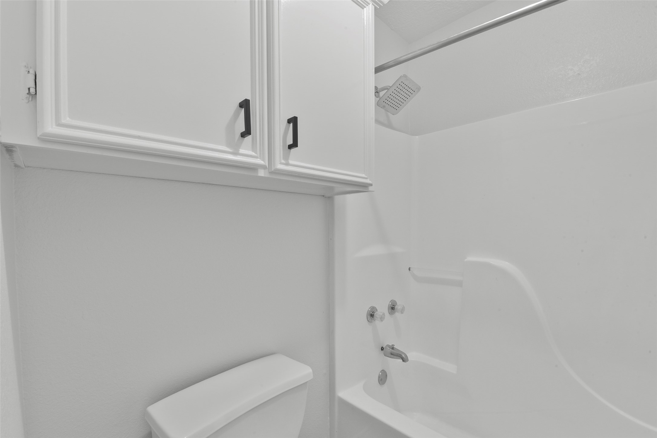 223 Oetken West Road Anahuac, TX 77514 - Photo 35 of 50 a bathroom with a toilet and a bathtub