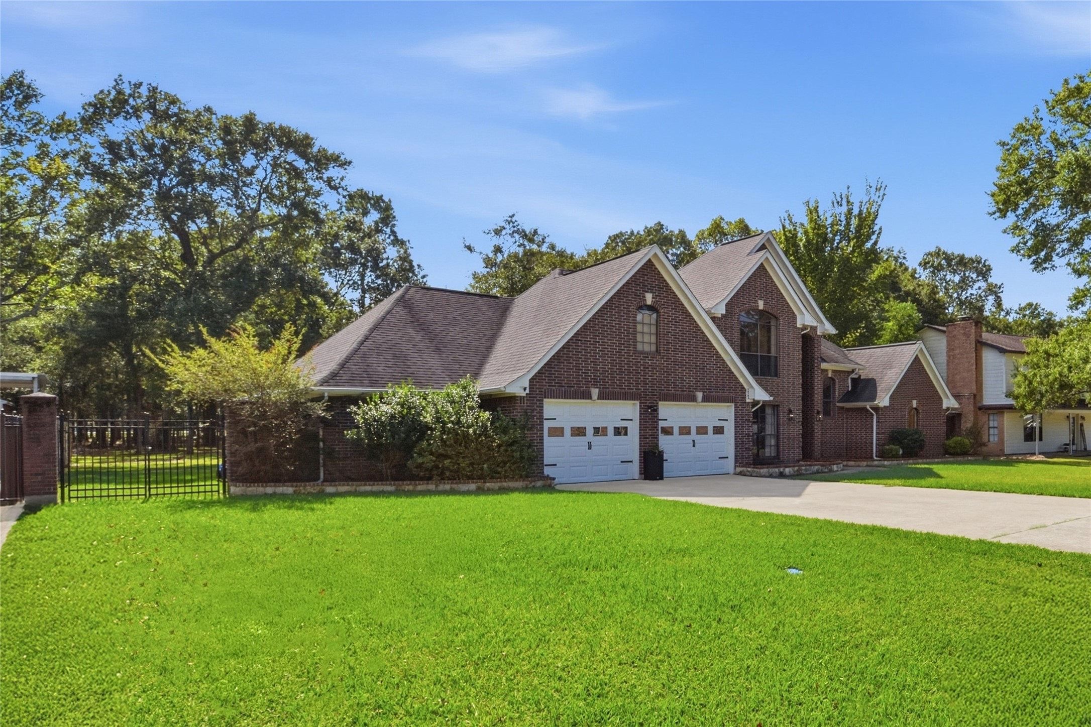 223 Oetken West Road Anahuac, TX 77514 - Photo 4 of 50 front view of a house with a yard