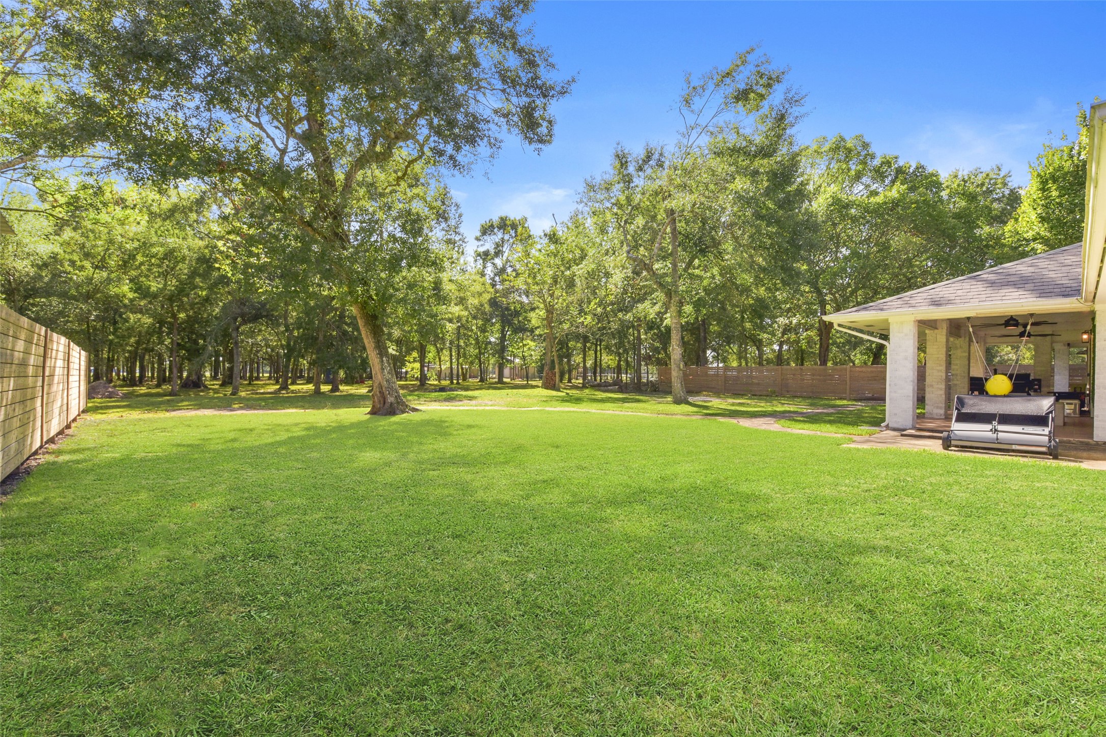 223 Oetken West Road Anahuac, TX 77514 - Photo 41 of 50 a view of outdoor space with garden and trees