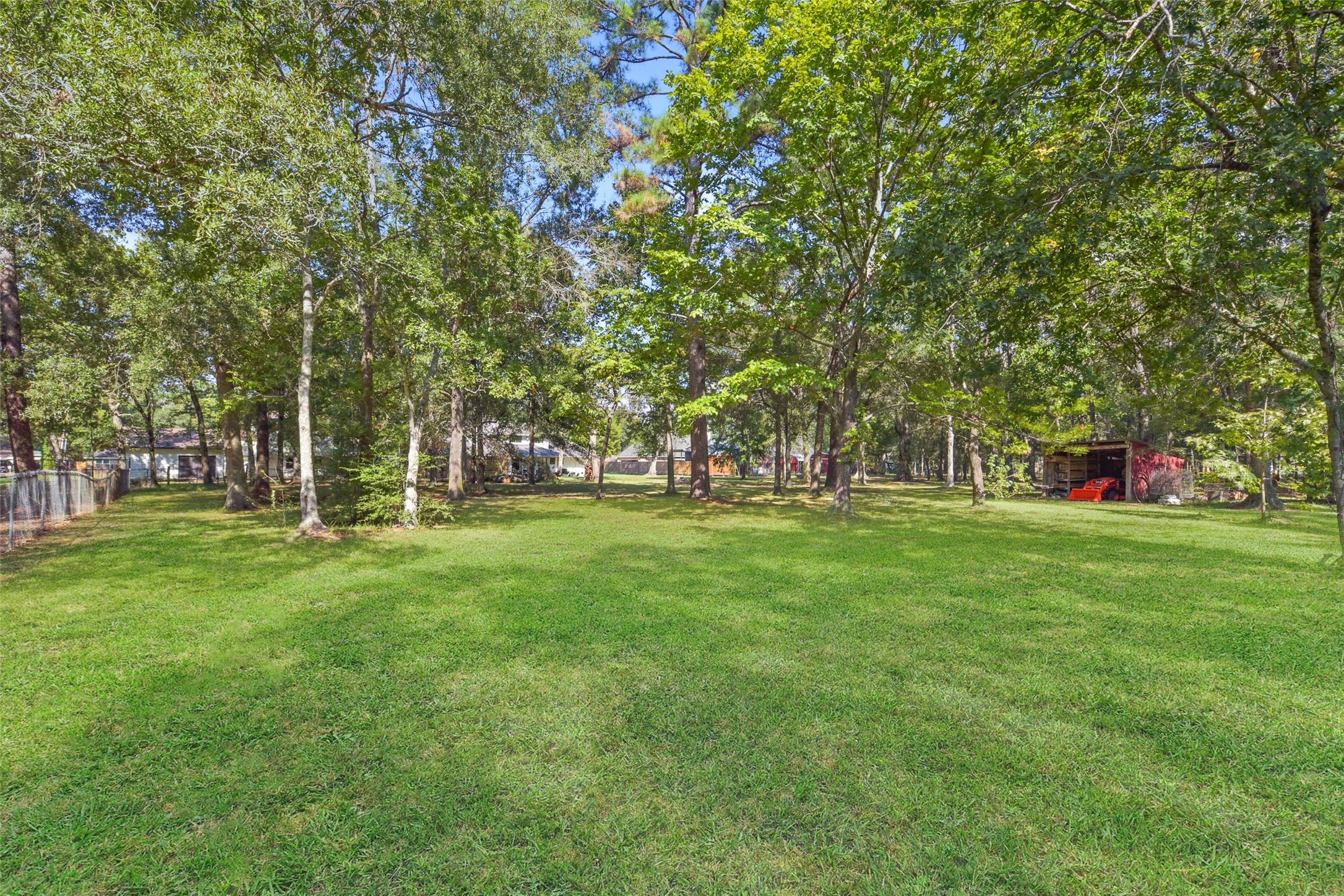 223 Oetken West Road Anahuac, TX 77514 - Photo 42 of 50 a huge green field with lots of trees