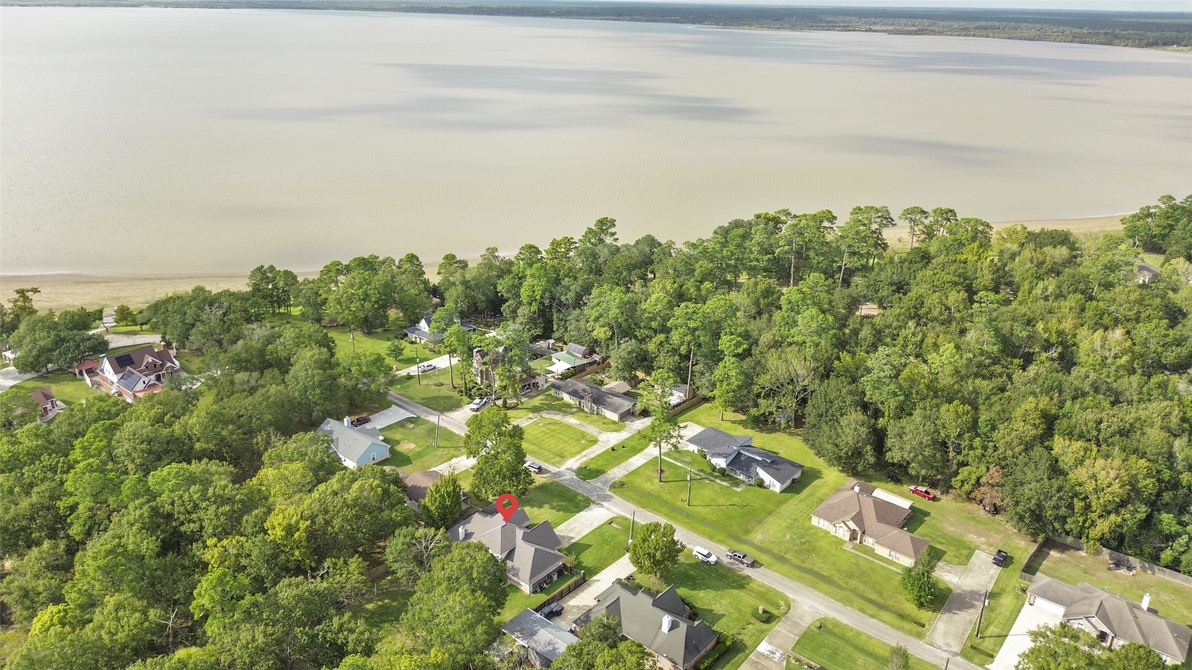 223 Oetken West Road Anahuac, TX 77514 - Photo 47 of 50 a view of a yard with an outdoor space