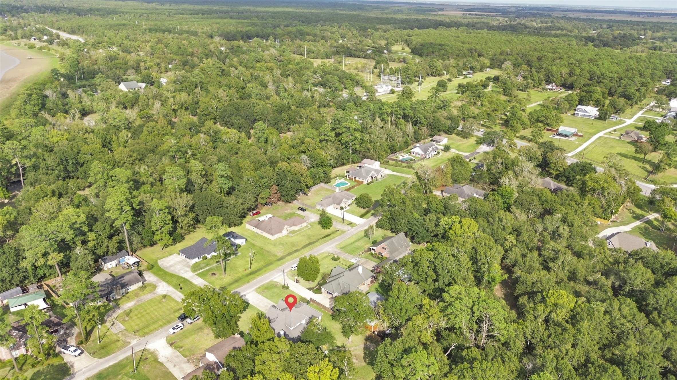 223 Oetken West Road Anahuac, TX 77514 - Photo 49 of 50 a view of a yard with an outdoor space