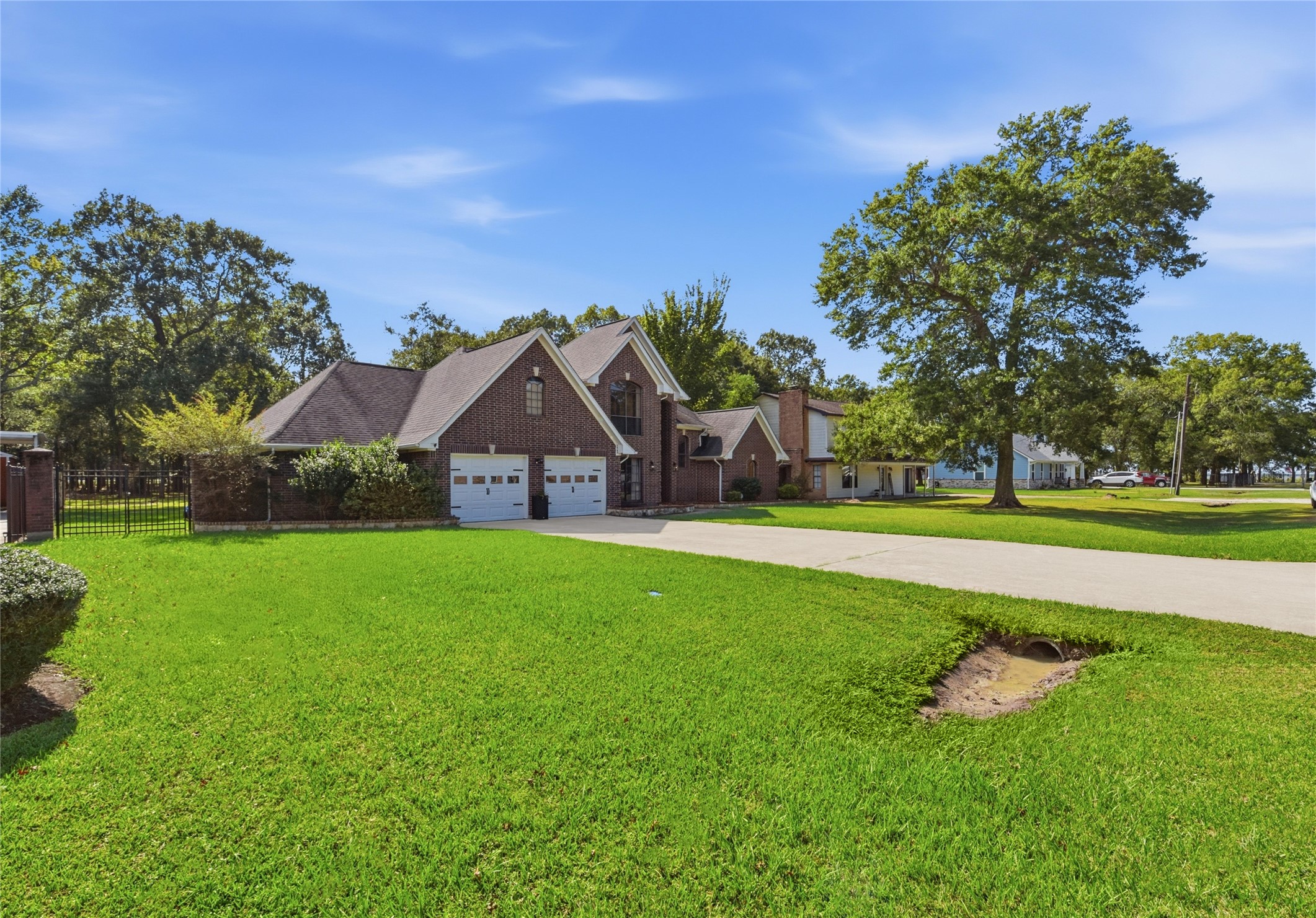 223 Oetken West Road Anahuac, TX 77514 - Photo 5 of 50 a view of a house with a big yard and potted plants