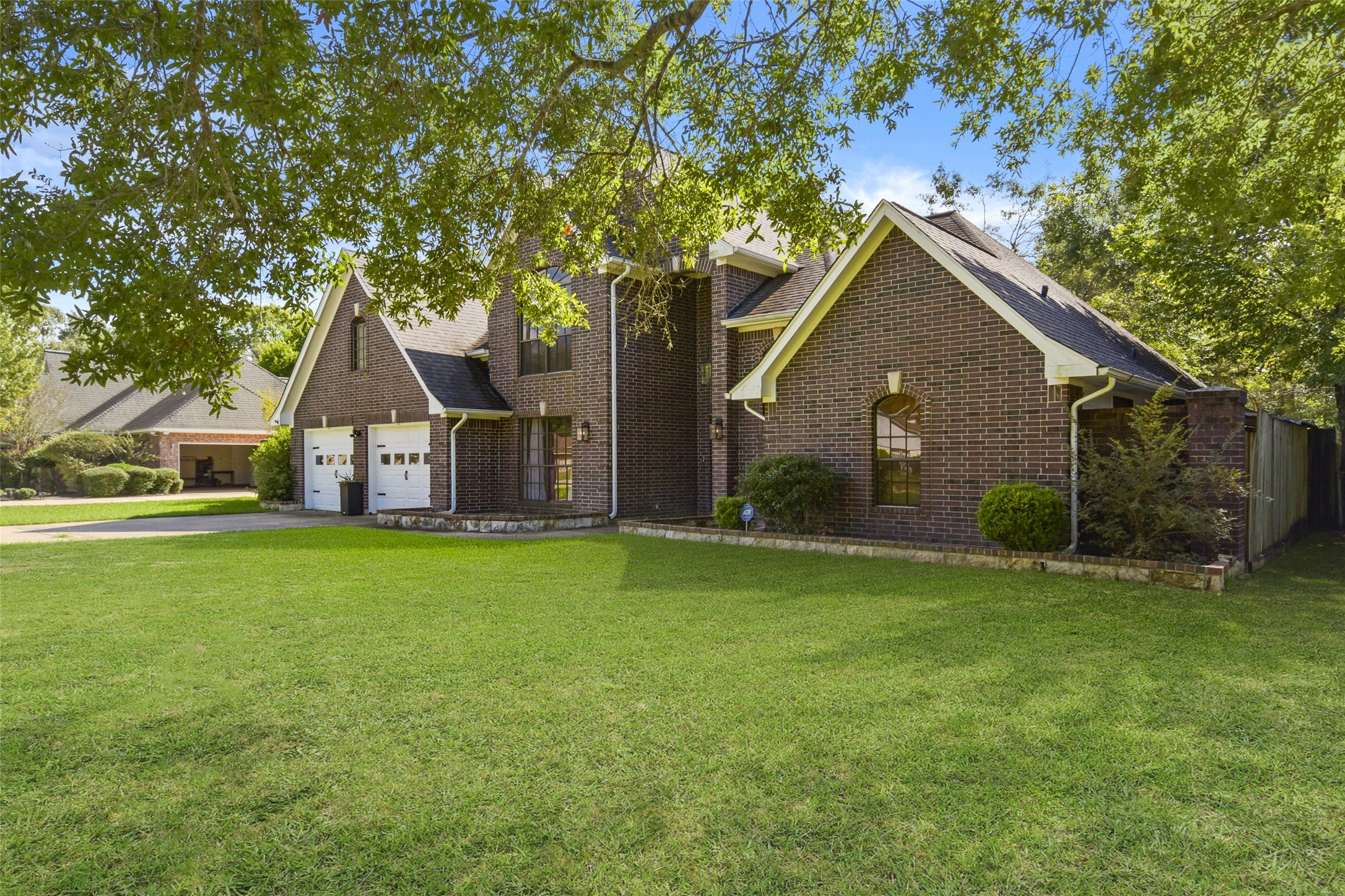 223 Oetken West Road Anahuac, TX 77514 - Photo 7 of 50 a view of a house with a yard and tree s